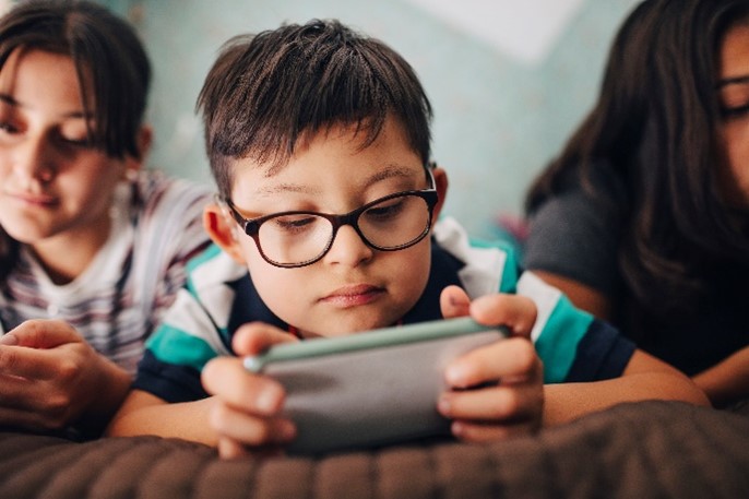Young boy video streaming on a tablet